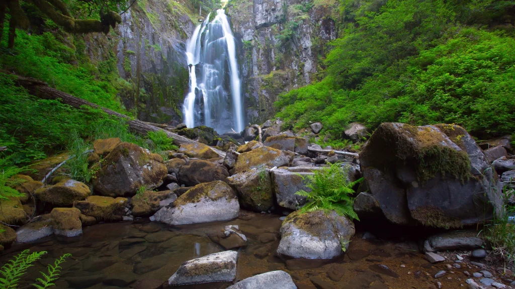 Waterfall greenery rocks stream nature tranquility