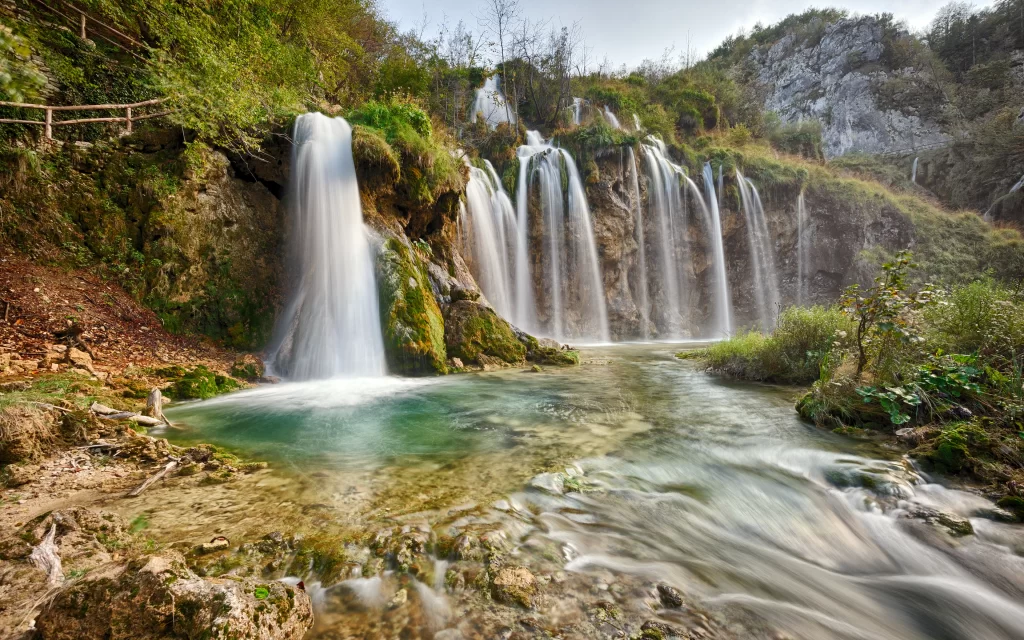 Waterfall nature landscape river greenery rocks serene scenic
