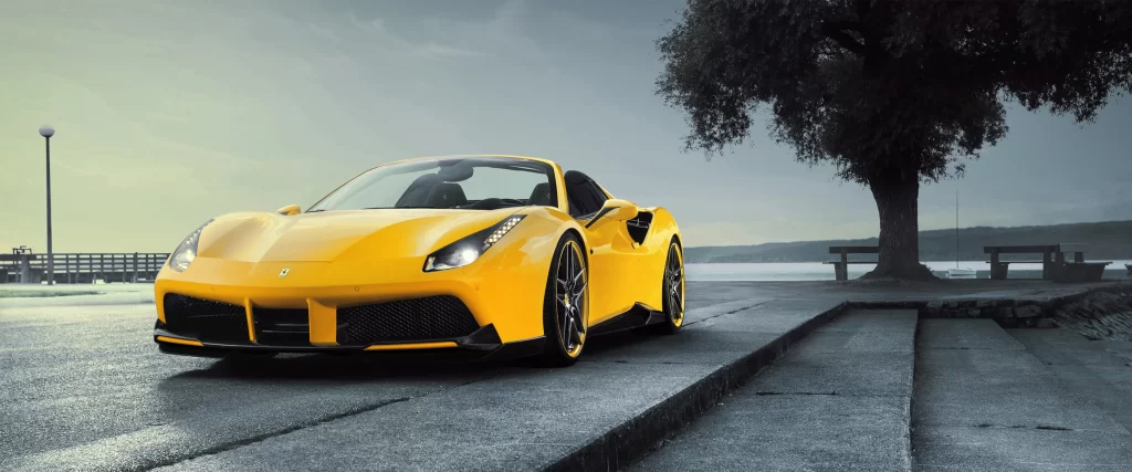 Yellow sports car, scenic background, tree, bench, waterfront, cloudy sky