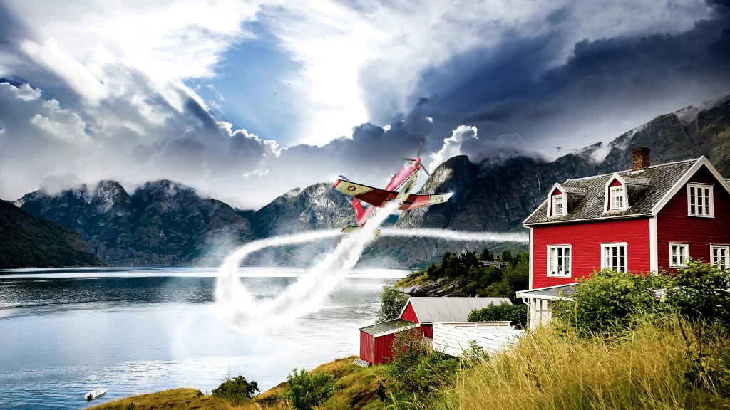 airplane lake mountains house clouds