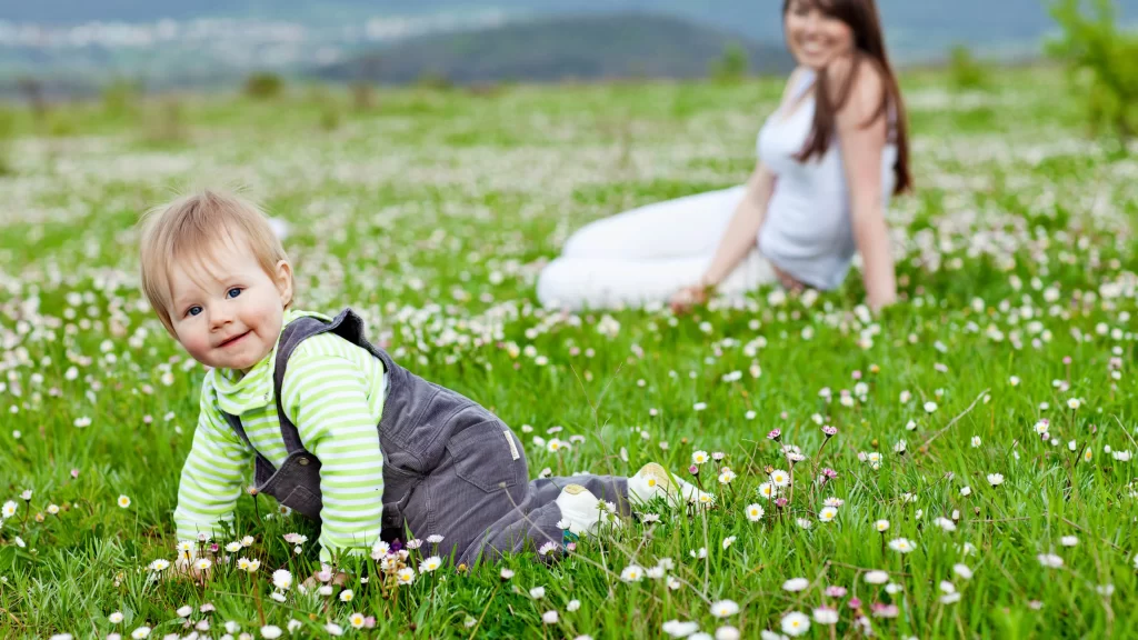 baby flowers field grass woman