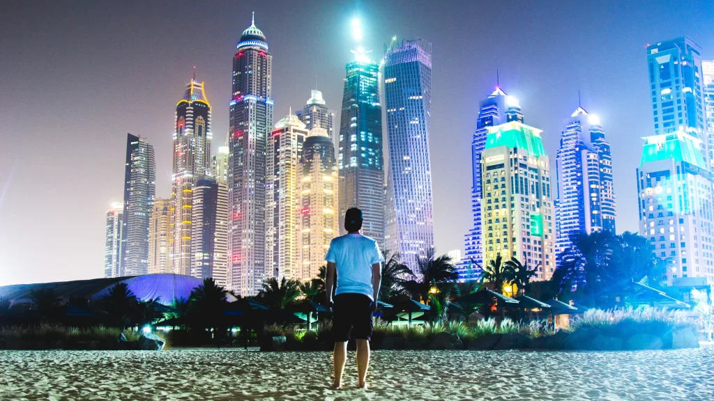 beach cityscape skyscrapers night lights urban