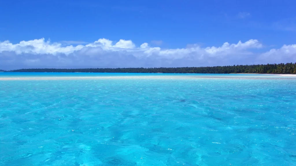 beach ocean water sky clouds tropical