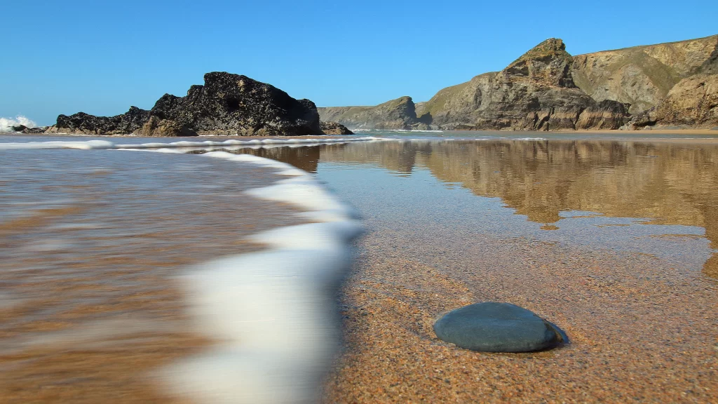 beach ocean waves rocks sky sand
