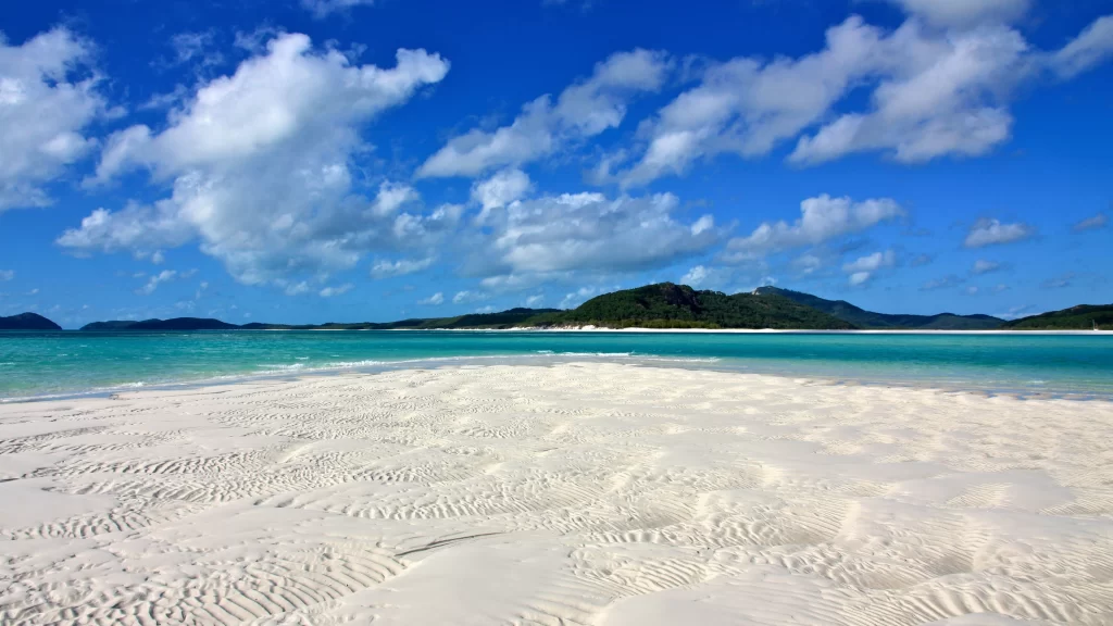 beach sand ocean sky clouds landscape