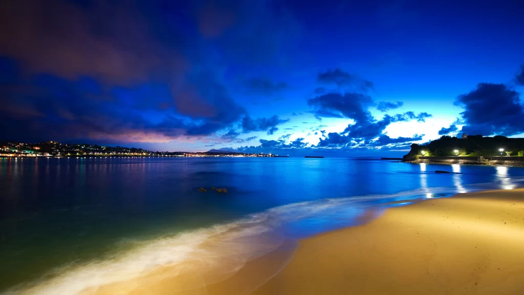 beach sunset ocean sky clouds lights