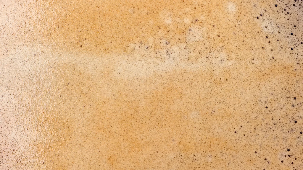 beer foam bubbles golden liquid surface texture effervescence