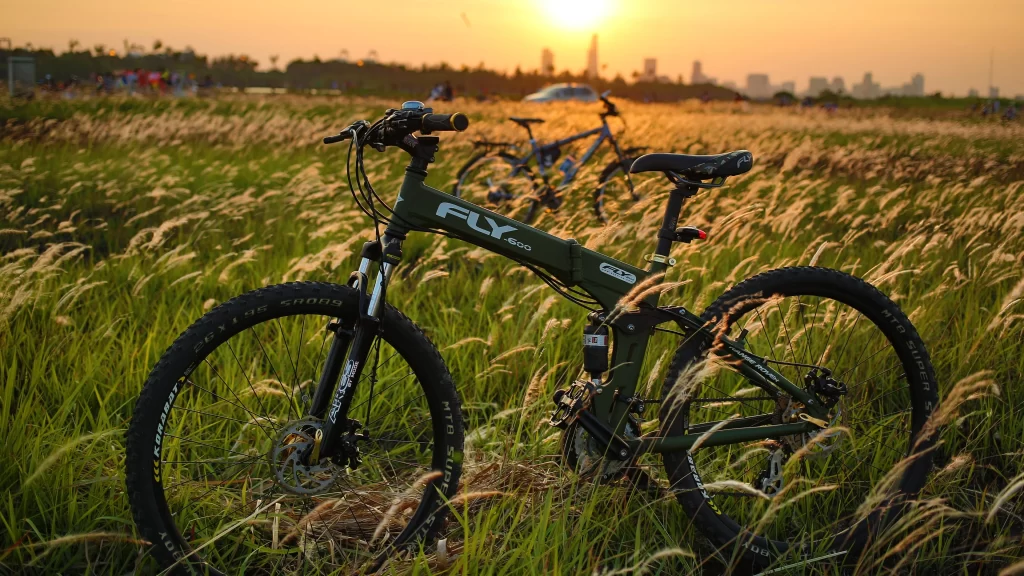 bicycle sunset grass cityscape adventure nature