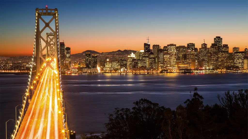 bridge city skyline sunset lights water