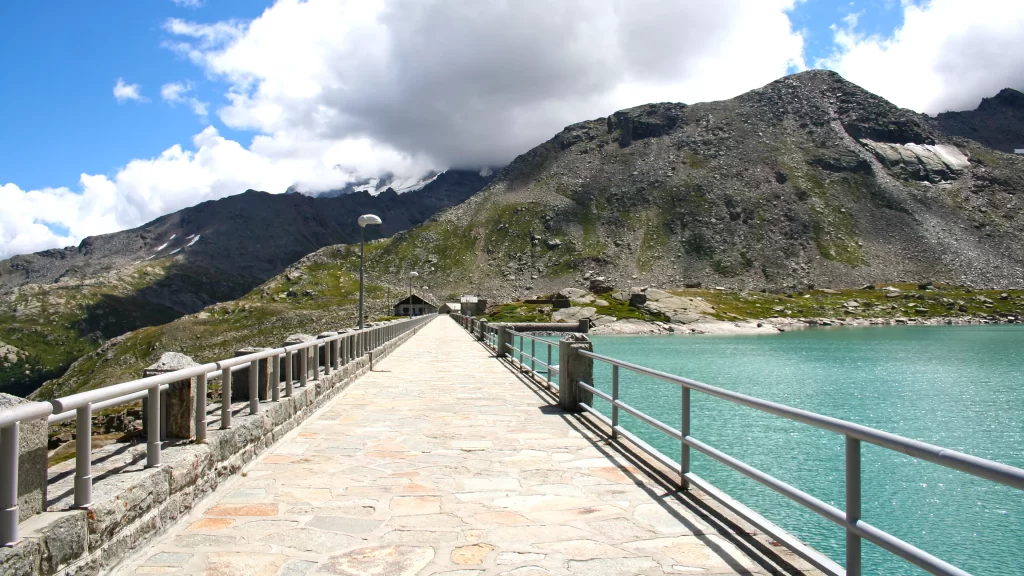 bridge lake mountains sky clouds path