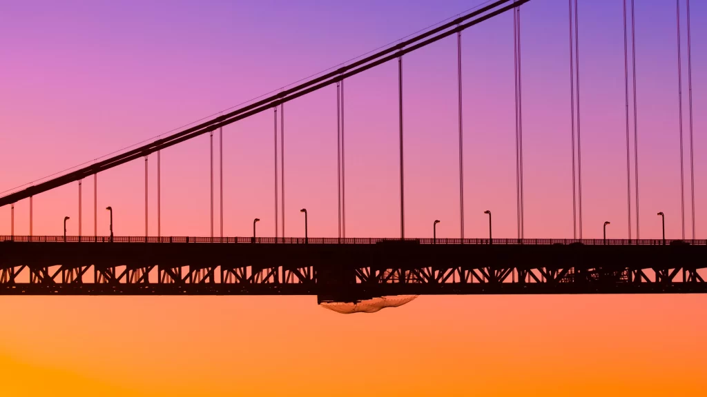 bridge sunset sky silhouette orange purple