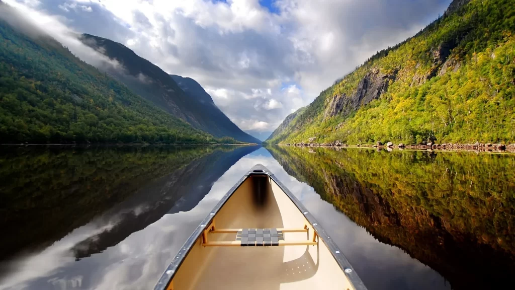 canoe lake mountains reflection nature clouds