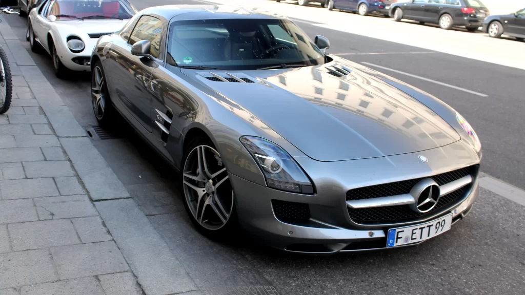 car Mercedes license plate street parked luxury