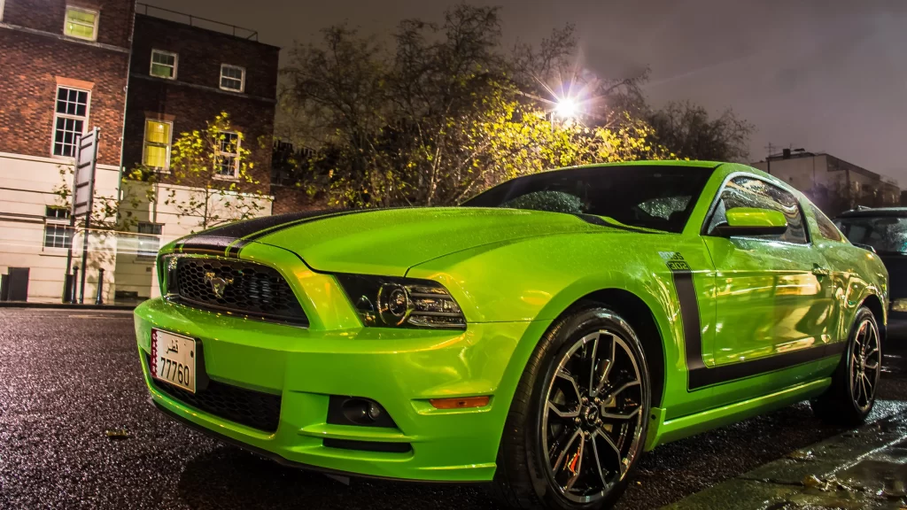 car green street night building trees