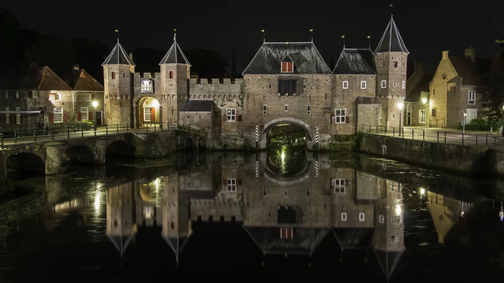 castle reflection night water bridge lights