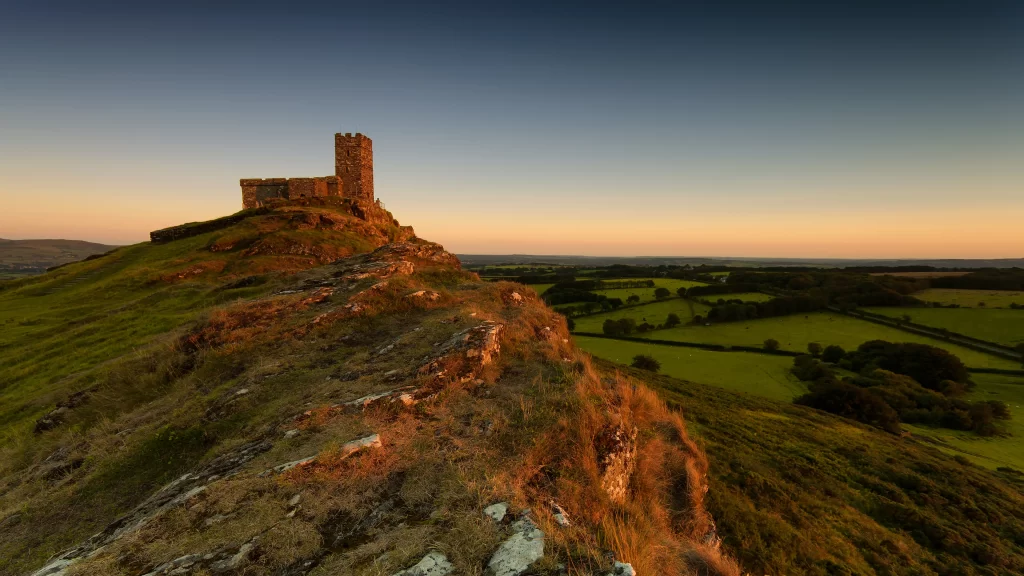 castle sunset landscape green fields sky clouds horizon