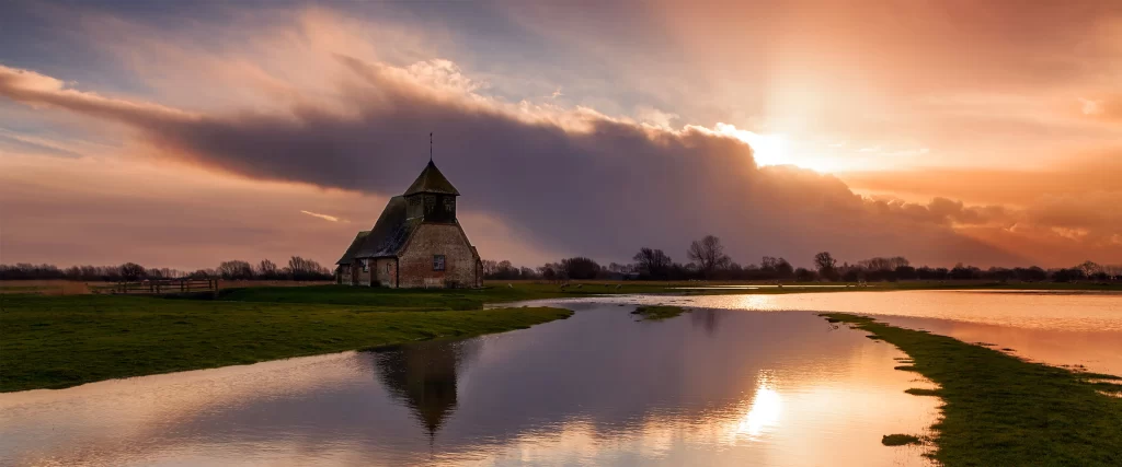 church sunset reflection water clouds sky