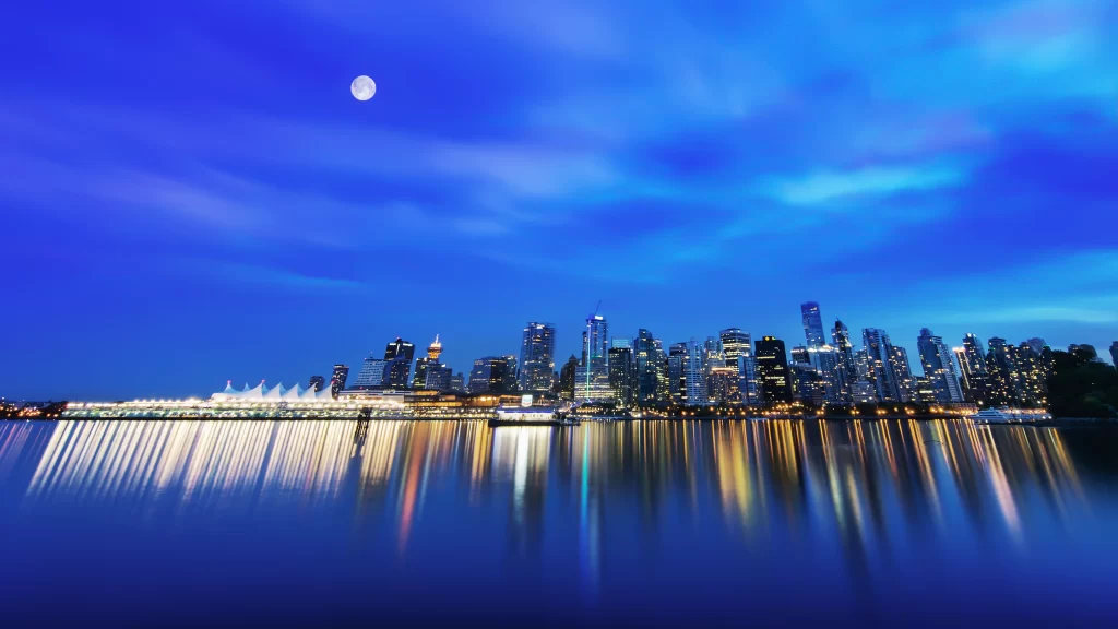 cityscape night moon reflection skyline lights water tranquility