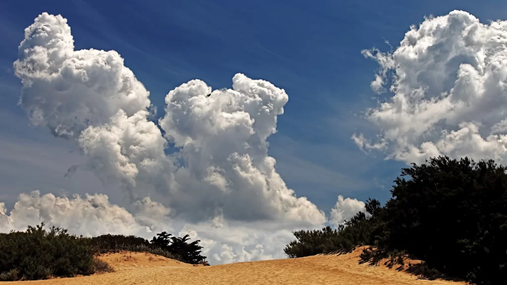clouds sky blue sand dunes