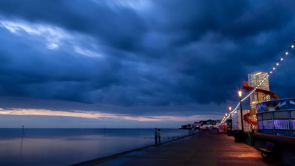 clouds sky sea promenade lights evening