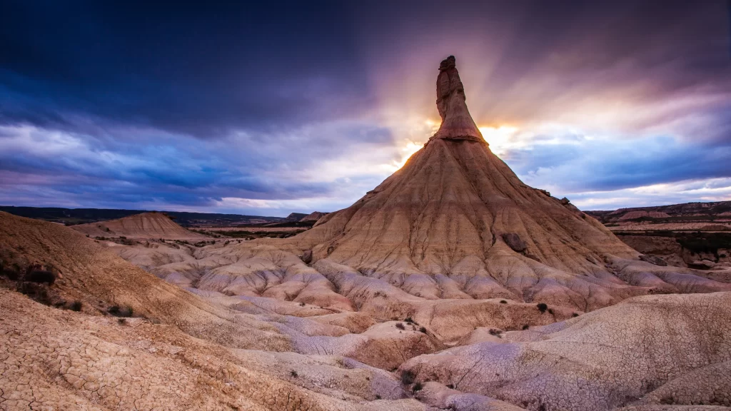 desert landscape rock formation dramatic sky sunset rugged terrain natural beaut