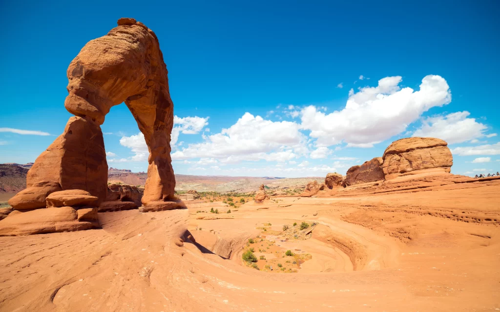 desert rock arch landscape blue sky