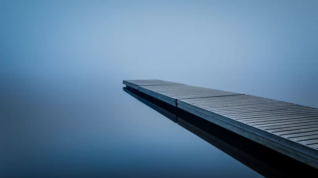 dock water reflection blue mist serene stillness tranquility