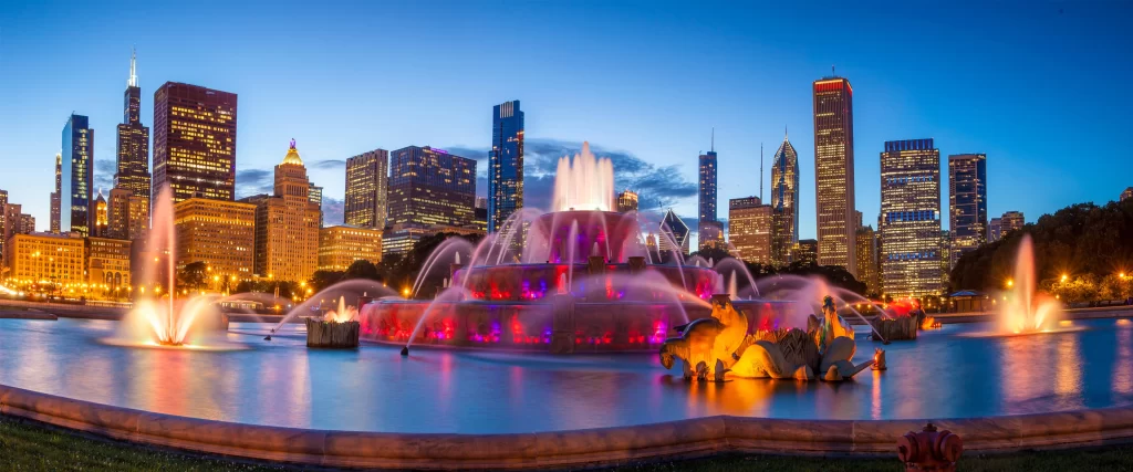 fountain cityscape skyscrapers lights evening