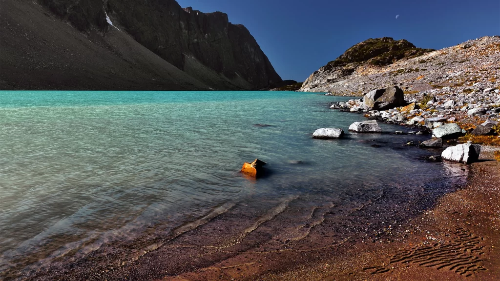 lake mountain clear water rocky shore