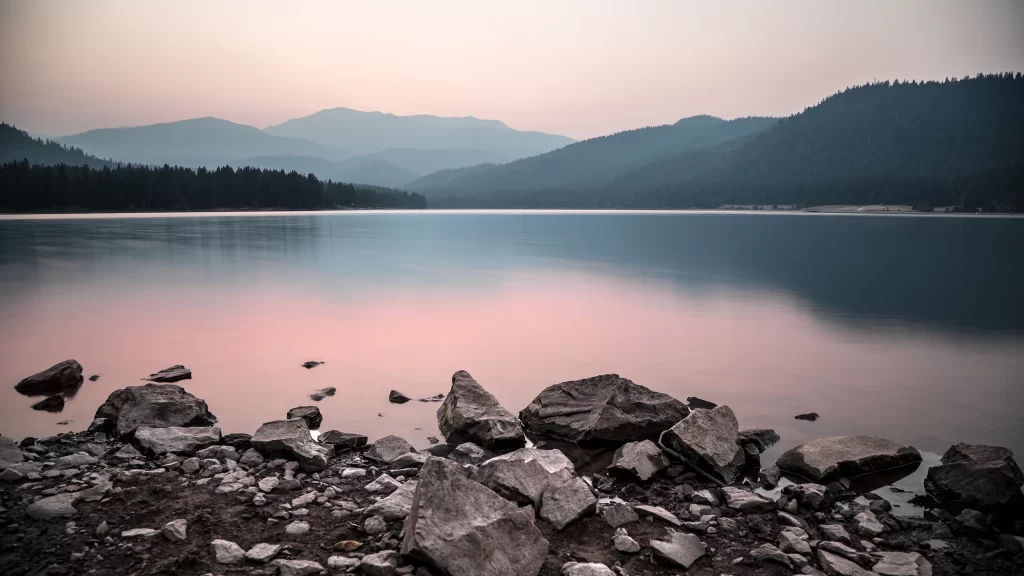 lake mountain rocks sunset reflection calm