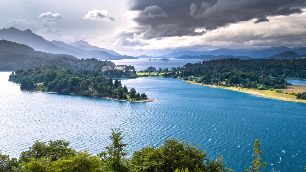 lake mountains trees clouds water landscape