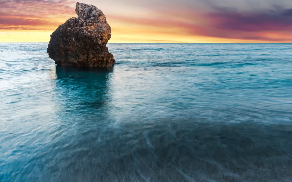 Sunset Ocean Rock Formation Clouds Reflection