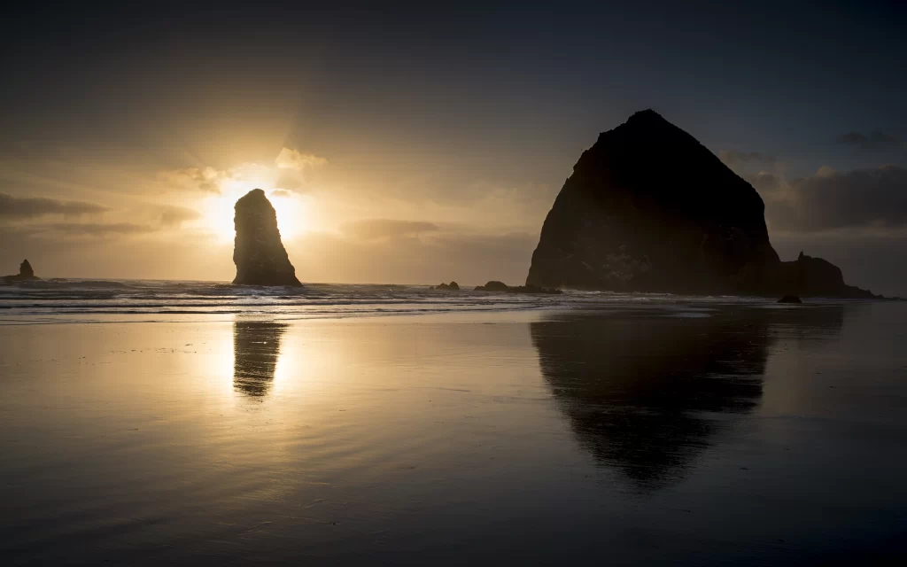 Sunset Silhouette Rock Formation Ocean Reflection