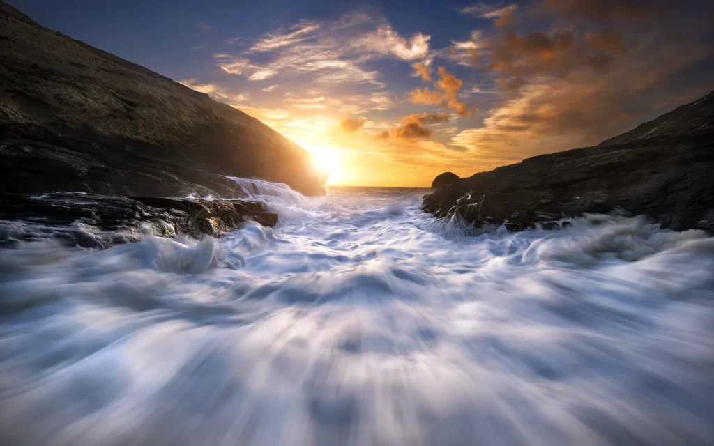 Sunset Ocean Waves Rocky Shoreline Clouds