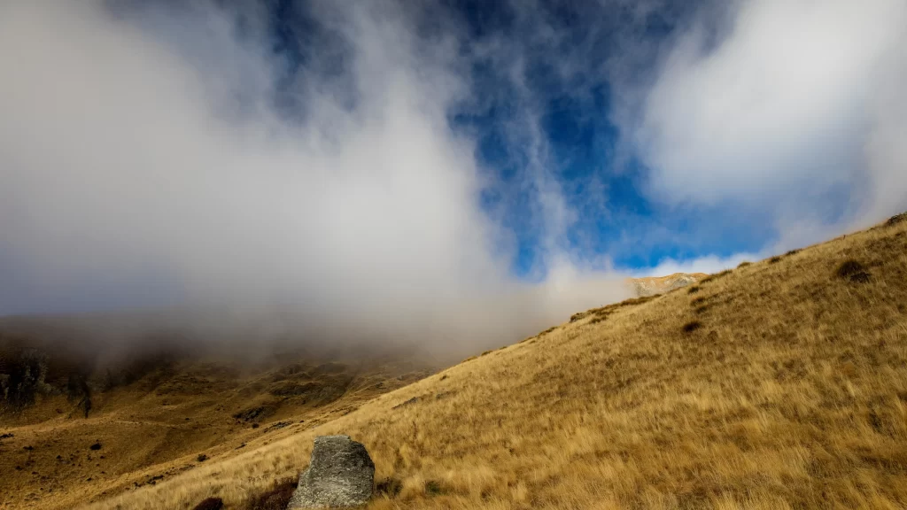 landscape clouds sky grass rock fog
