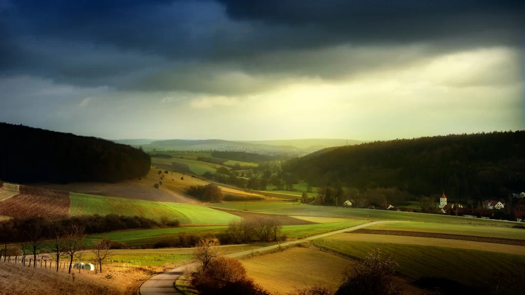 landscape fields sunlight clouds rural tranquility