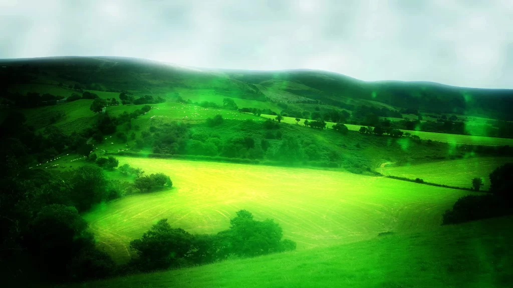 landscape green fields hills trees sky