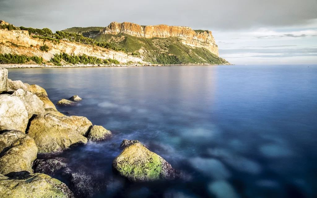 landscape ocean rocks cliffs sky clouds