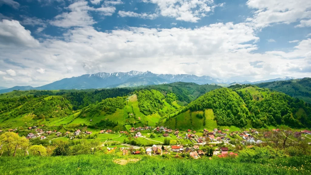 landscape village hills green sky clouds