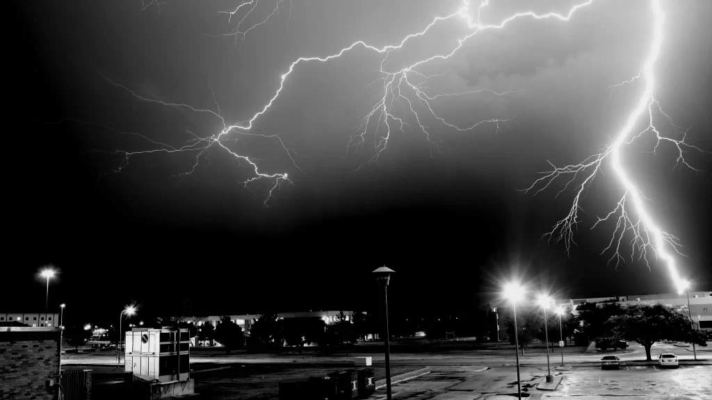 lightning storm night city black and white dramatic