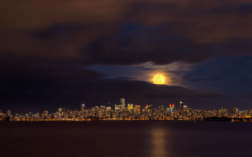 moon cityscape night lights reflection clouds