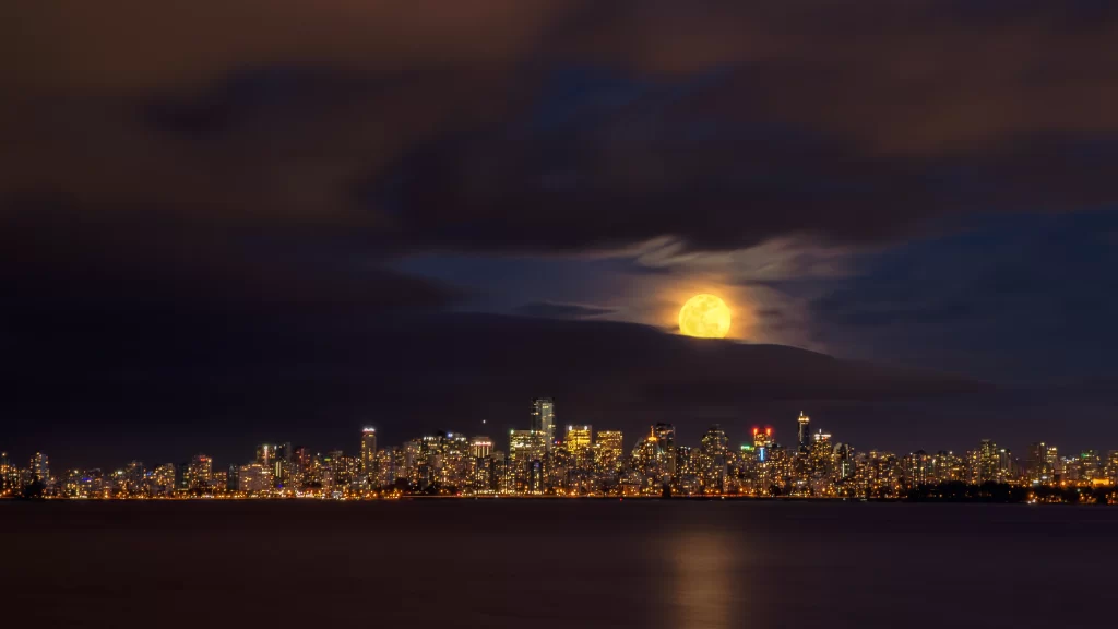 moon cityscape night lights reflection clouds