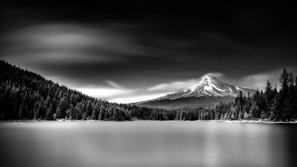 mountain lake forest snow clouds