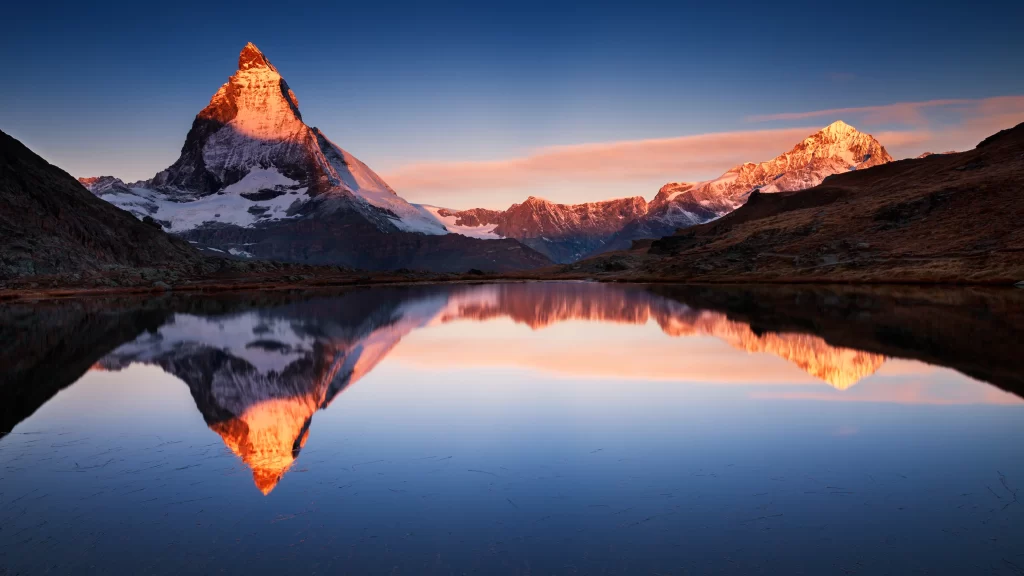 mountain lake reflection sunrise snowscape