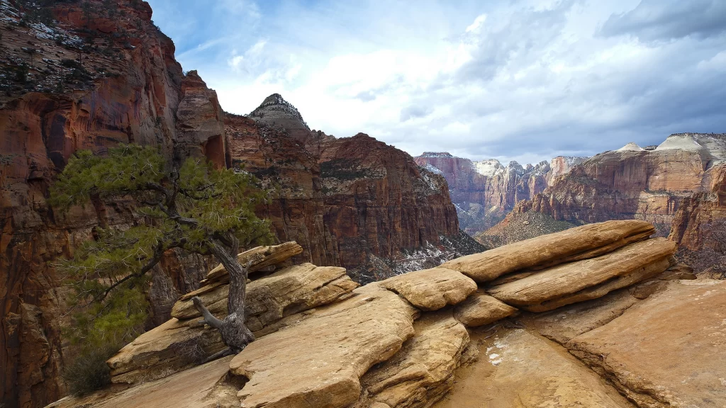 mountain landscape rocky terrain tree sky clouds