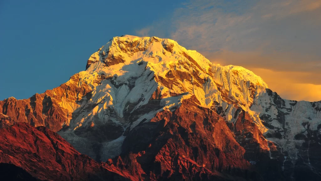 mountain snow peak sunlight clouds