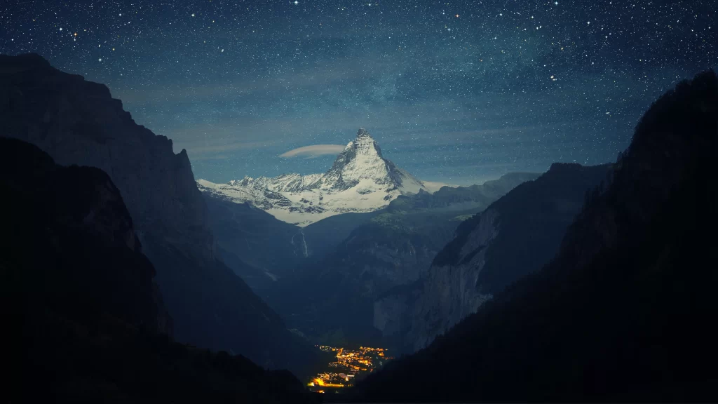 mountain snow starry night sky village
