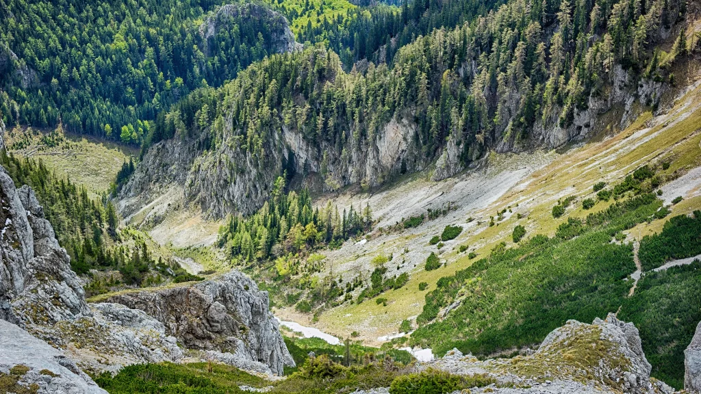 mountain valley greenery rocky terrain sunlight natural landscape serene