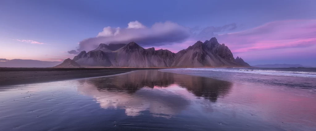mountains beach sunset reflection clouds sky