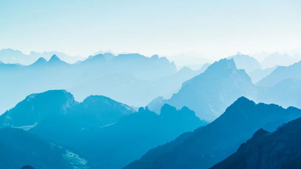 mountains blue sky fog peaks landscape